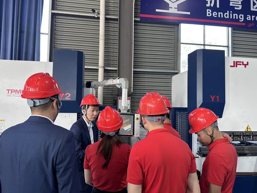 Vietnamese customer inspecting CNC bending production equipment