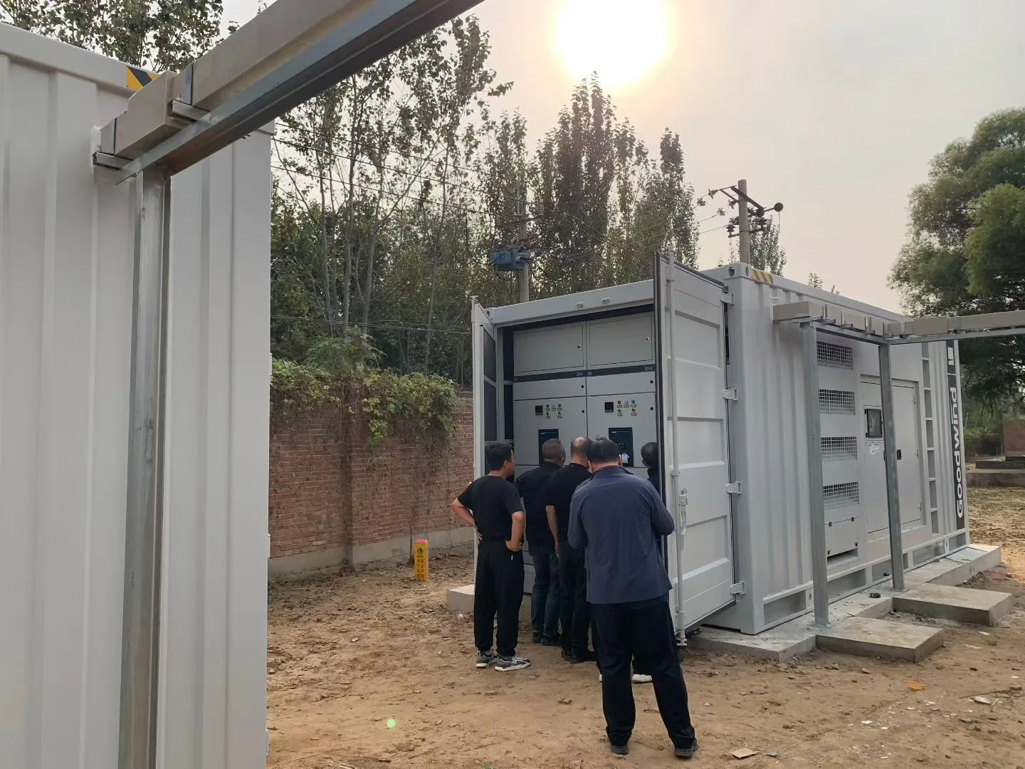 On-site personnel viewing electrical cabinets at the Beijing central kitchen generator project