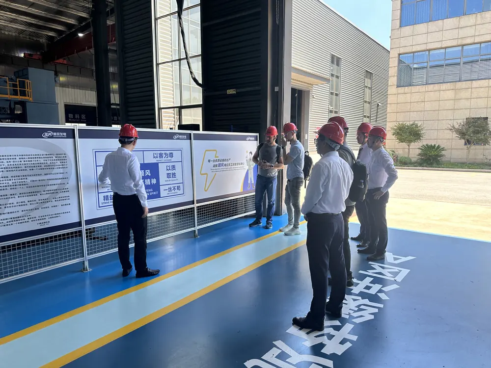 Russian customers receiving a production briefing inside the GOODWIND generator factory