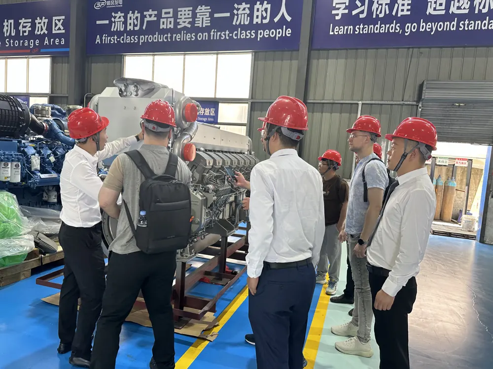 Russian customers inspecting diesel generator engines in the GOODWIND workshop