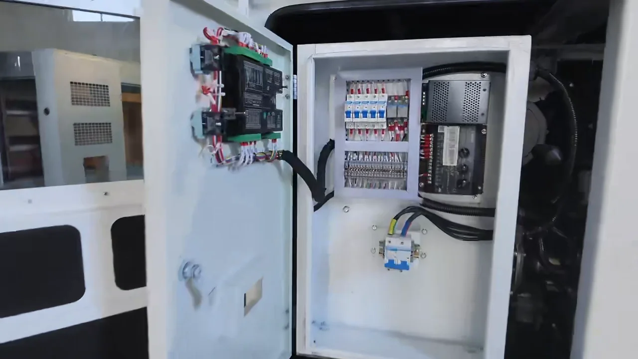 Open generator control cabinet with wiring, terminals and electrical components