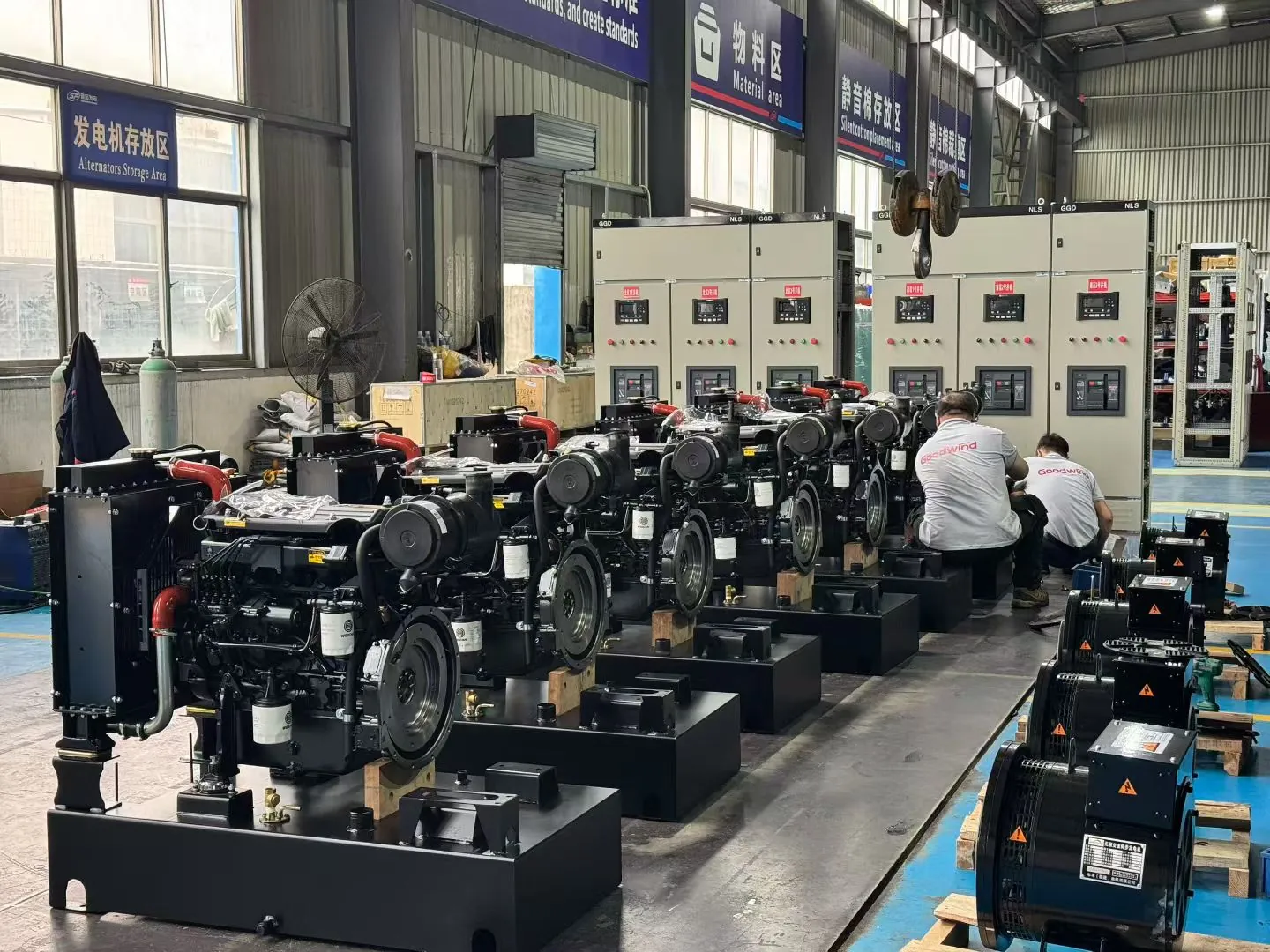 GOODWIND technicians assembling generator engines and alternators in the workshop