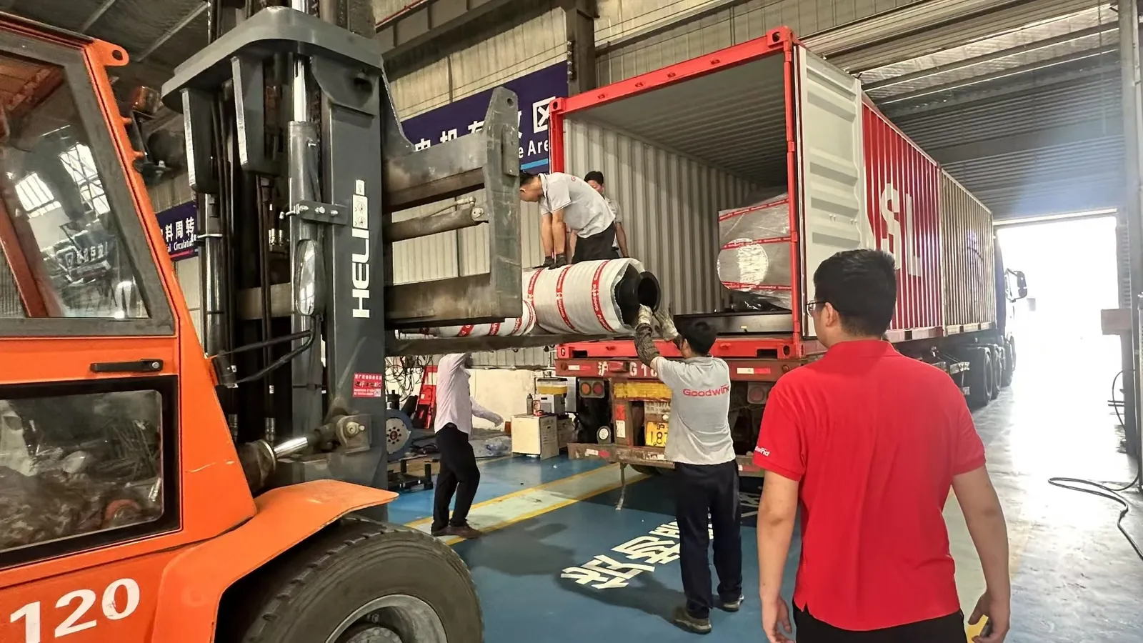 GOODWIND generator equipment being loaded into a shipping container for delivery