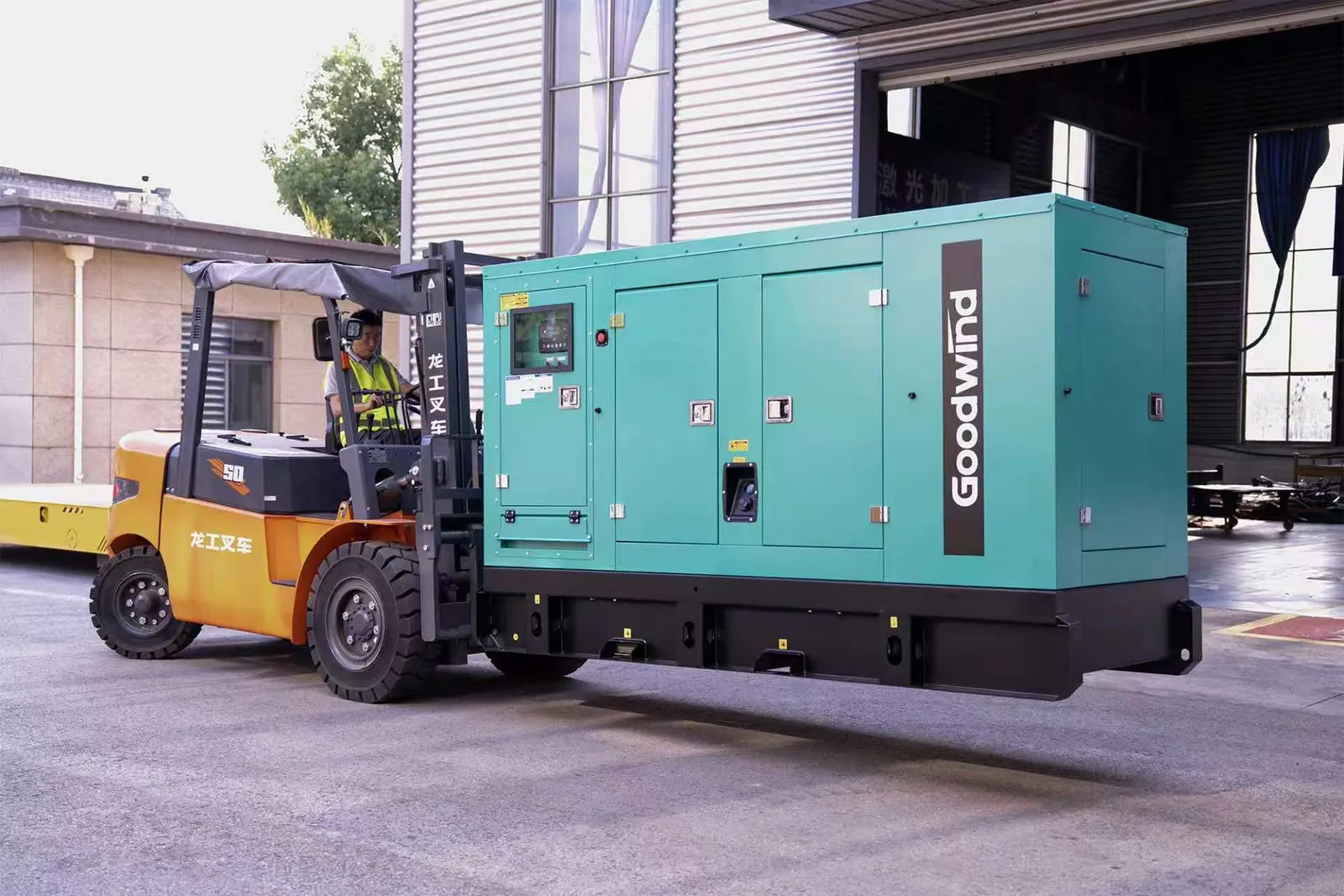 GOODWIND rental diesel generator being handled by forklift at the factory